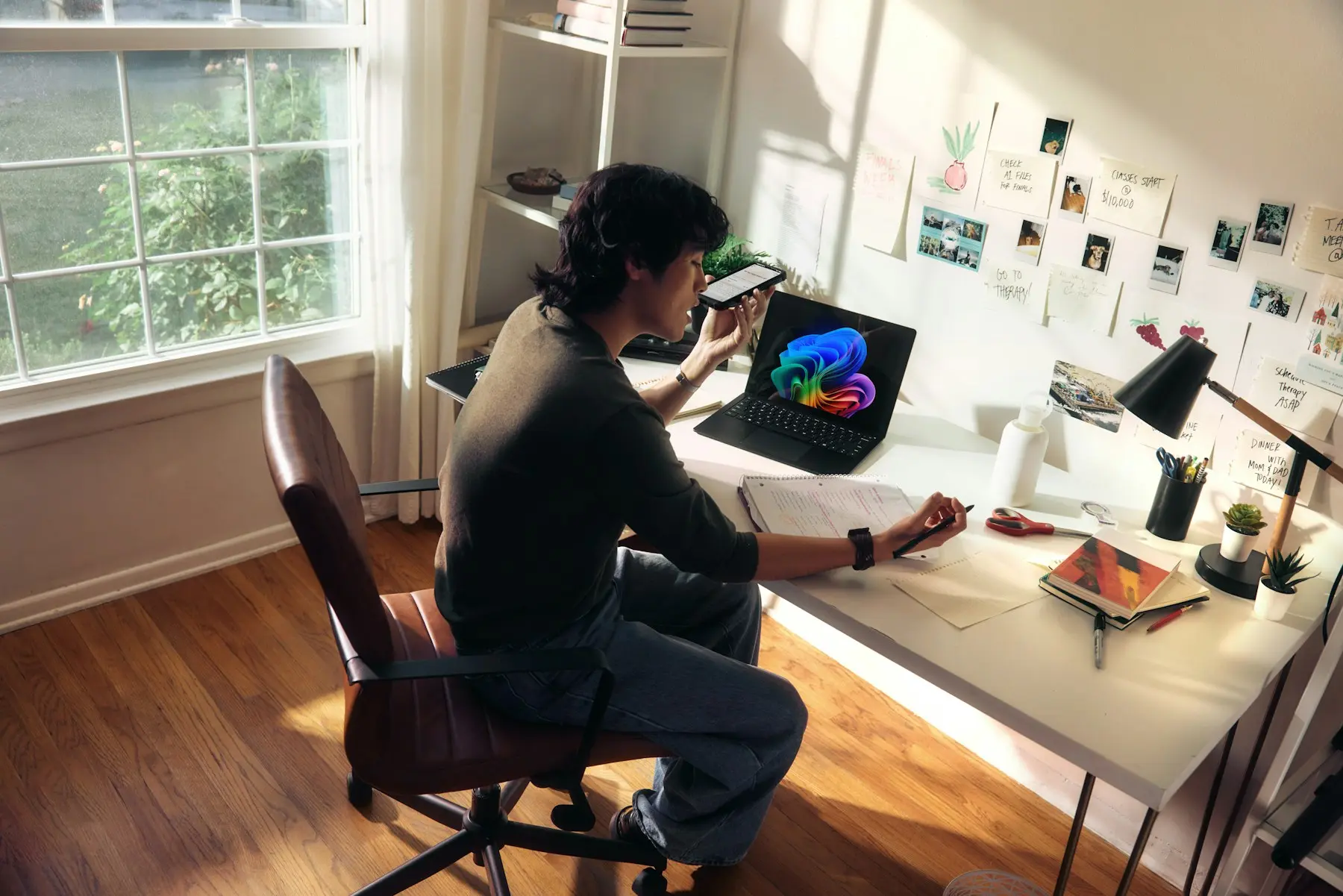 A creative professional planning a digital project at a sunlit desk